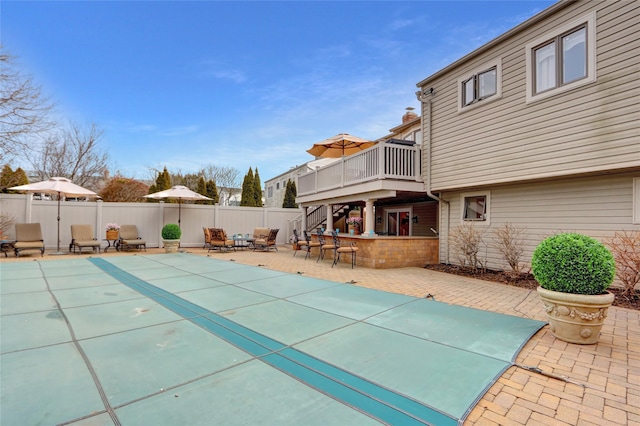 view of pool with a deck, a fenced backyard, stairway, a fenced in pool, and a patio area