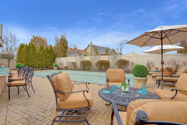 view of patio with a fenced backyard and a fenced in pool