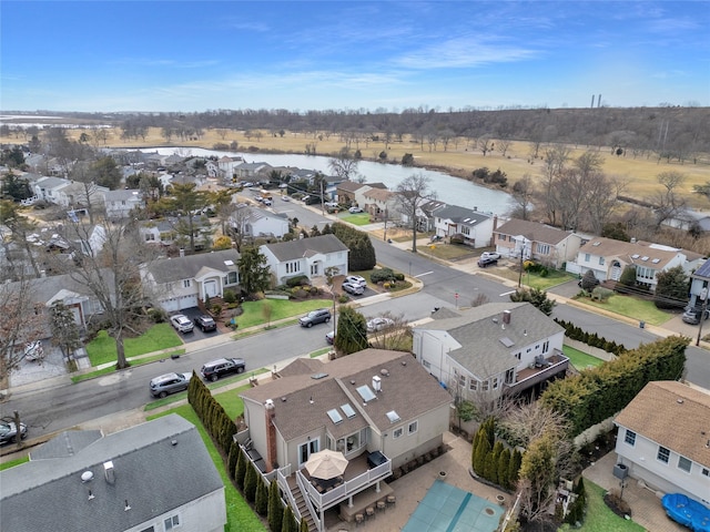 bird's eye view with a residential view and a water view