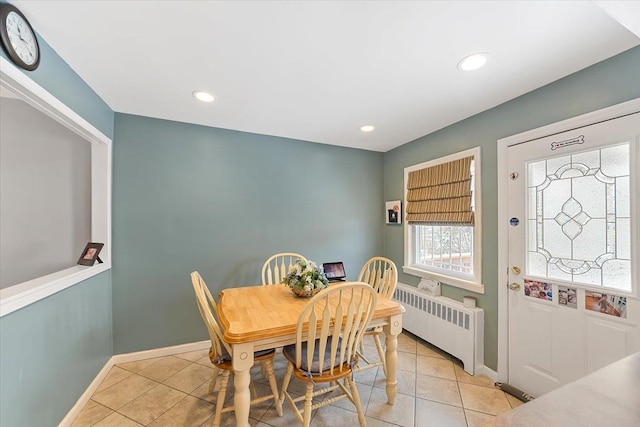 dining space featuring recessed lighting, baseboards, radiator heating unit, and light tile patterned floors