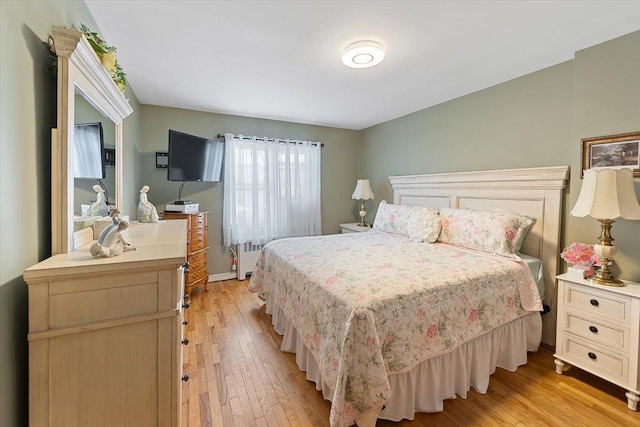 bedroom featuring light wood-style floors