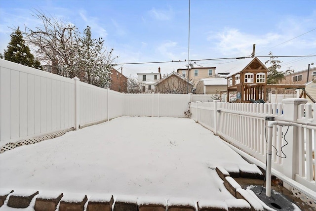 view of yard featuring a fenced backyard and a playground