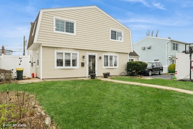 18 Old Farm Rd, Levittown, NY 11756 - view of front facade featuring a gambrel roof and a gate