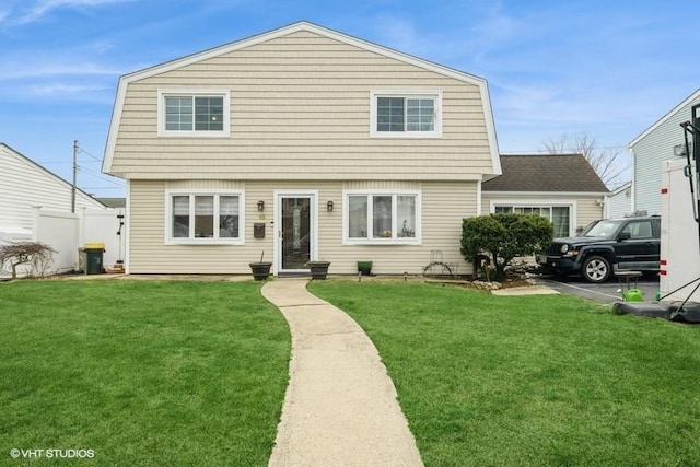 18 Old Farm Rd, Levittown, NY 11756 - colonial-style house featuring a front yard and a gambrel roof