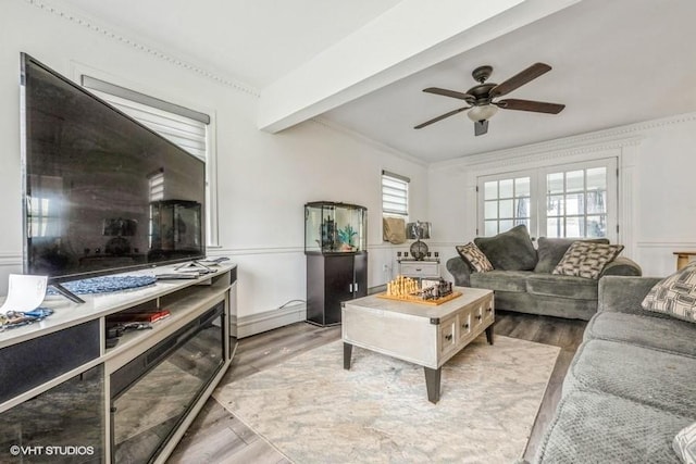 18 Old Farm Rd, Levittown, NY 11756 - living room with wood finished floors, ceiling fan, ornamental molding, and a baseboard heating unit