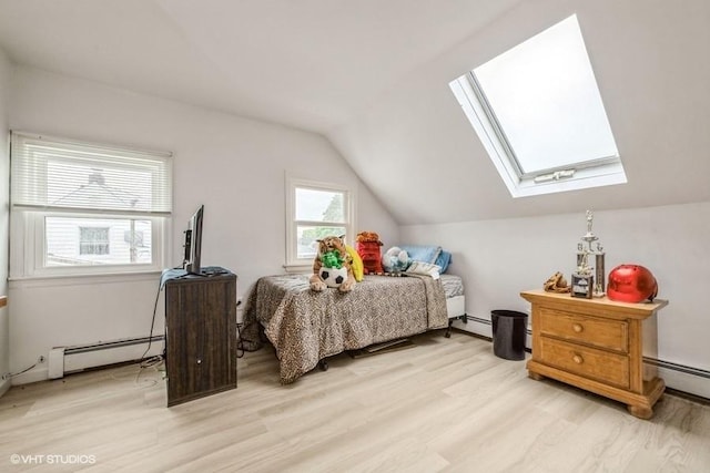 18 Old Farm Rd, Levittown, NY 11756 - bedroom with baseboard heating, a skylight, light wood-type flooring, and lofted ceiling