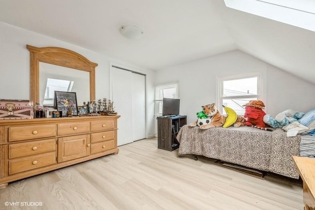 18 Old Farm Rd, Levittown, NY 11756 - bedroom featuring light wood-type flooring, vaulted ceiling, and a closet
