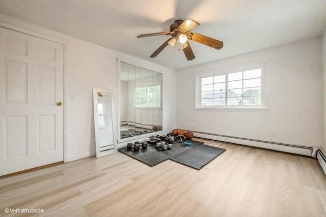18 Old Farm Rd, Levittown, NY 11756 - exercise room with wood finished floors, a baseboard heating unit, and a ceiling fan