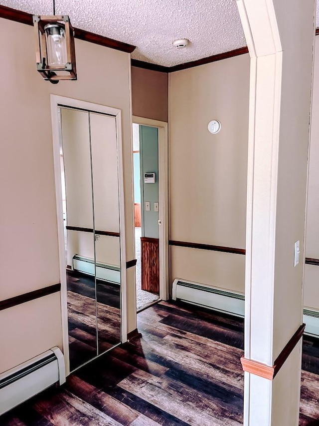 521 Hessinger Lare Rd, Jeffersonville, NY 12748 - hall with a baseboard radiator, wood finished floors, crown molding, and a textured ceiling