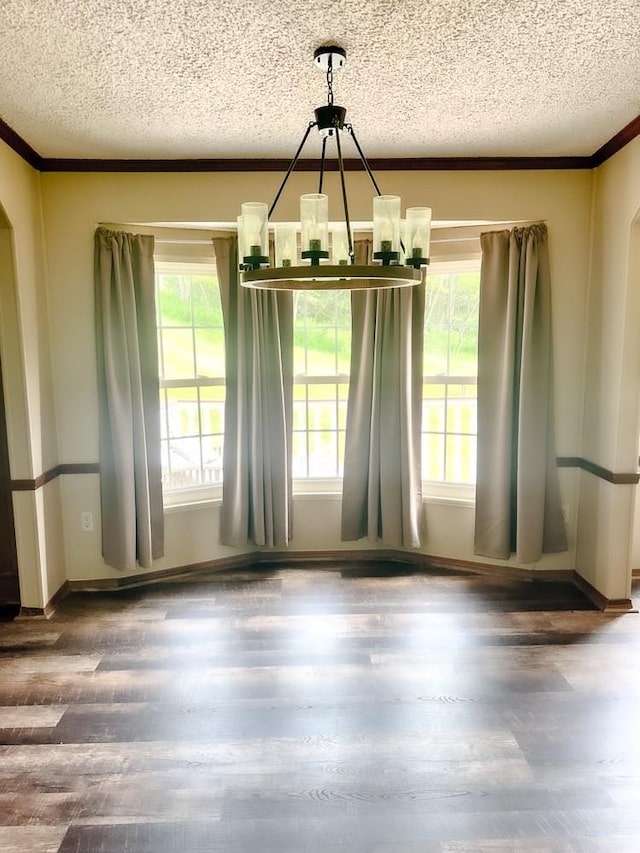 521 Hessinger Lare Rd, Jeffersonville, NY 12748 - unfurnished dining area featuring a chandelier, a textured ceiling, ornamental molding, plenty of natural light, and wood finished floors