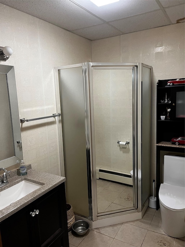 521 Hessinger Lare Rd, Jeffersonville, NY 12748 - full bath featuring baseboard heating, vanity, a stall shower, and tile patterned floors