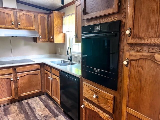 521 Hessinger Lare Rd, Jeffersonville, NY 12748 - kitchen with black appliances, extractor fan, brown cabinets, dark wood-type flooring, and light countertops