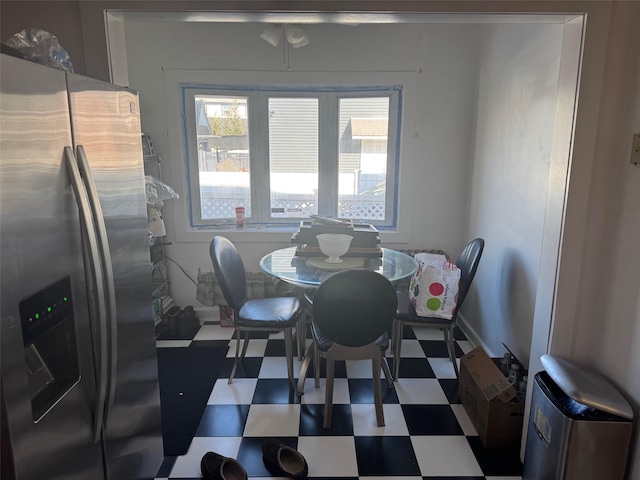 dining space featuring baseboards and tile patterned floors