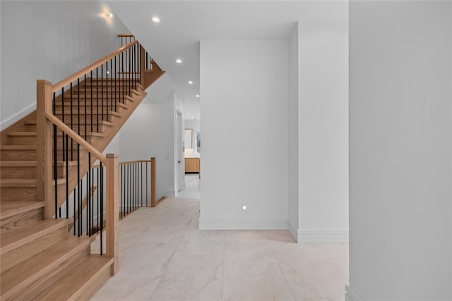 66 S Madison Ave Unit 212, Spring Valley, NY 10977 - stairs with recessed lighting, marble finish floor, and baseboards