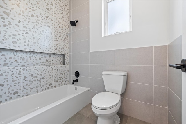 66 S Madison Ave Unit 212, Spring Valley, NY 10977 - full bath featuring tile patterned flooring, tile walls, toilet, and bathing tub / shower combination