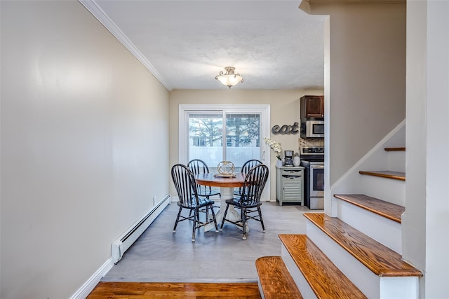 dining area with light wood finished floors, baseboards, stairway, baseboard heating, and crown molding