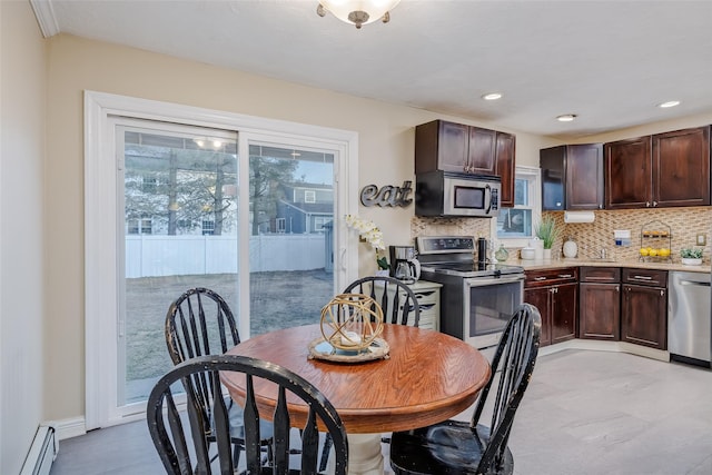 dining area with baseboard heating and recessed lighting