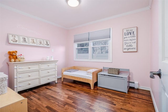 bedroom featuring baseboards, a baseboard heating unit, dark wood-style flooring, and ornamental molding