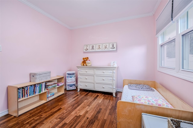 bedroom with baseboards, hardwood / wood-style flooring, and crown molding