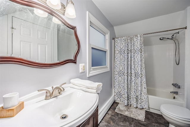 bathroom with vanity, baseboard heating, shower / bath combo with shower curtain, and toilet