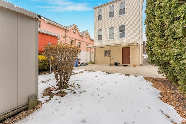 back of house featuring a patio area and fence