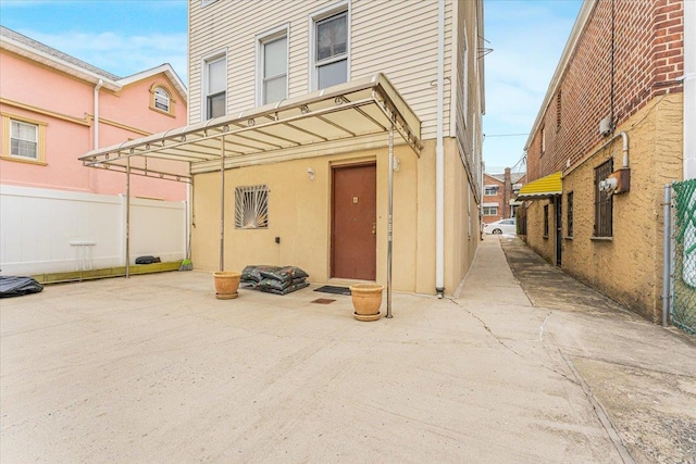 back of house with a patio area and fence