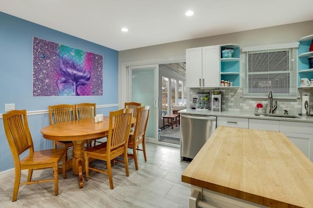 dining space featuring recessed lighting