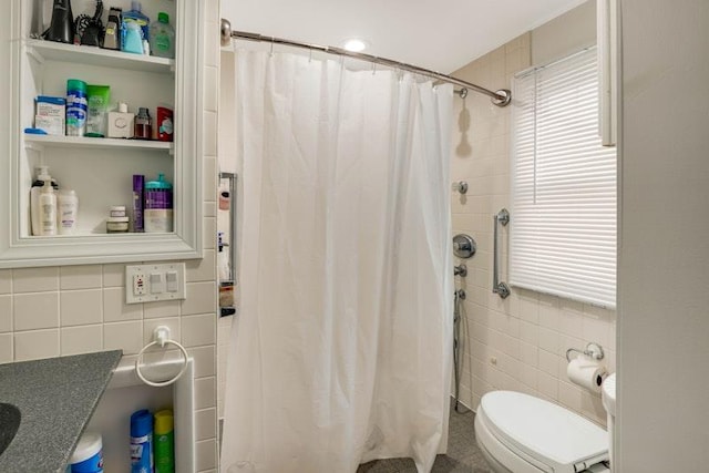 bathroom with a healthy amount of sunlight, toilet, tile walls, and a shower with shower curtain