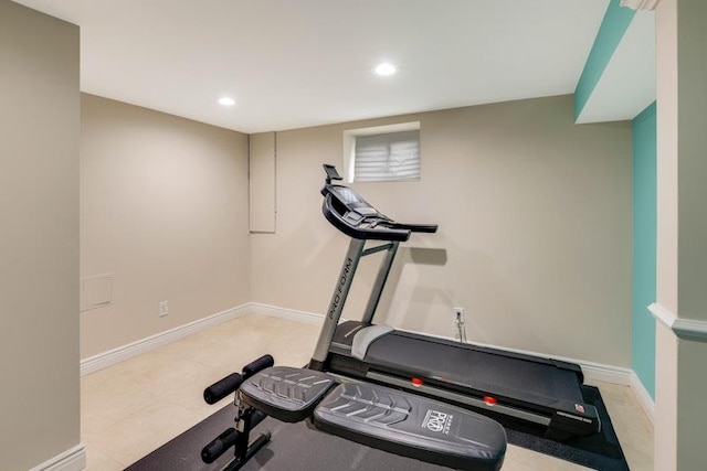 workout area featuring baseboards and recessed lighting