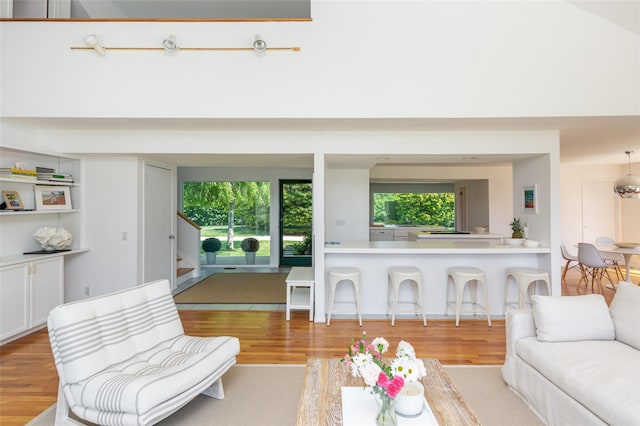 20 Winding Way, Water Mill, NY 11976 - living room with a towering ceiling, a wealth of natural light, stairs, and wood finished floors
