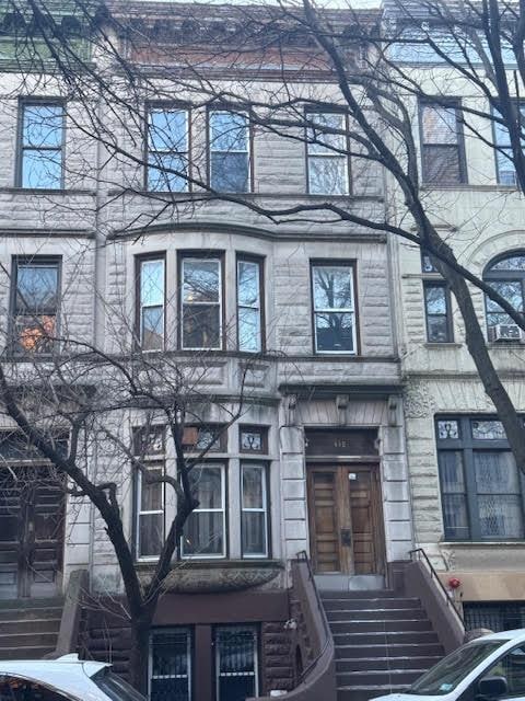 view of front of house with stone siding