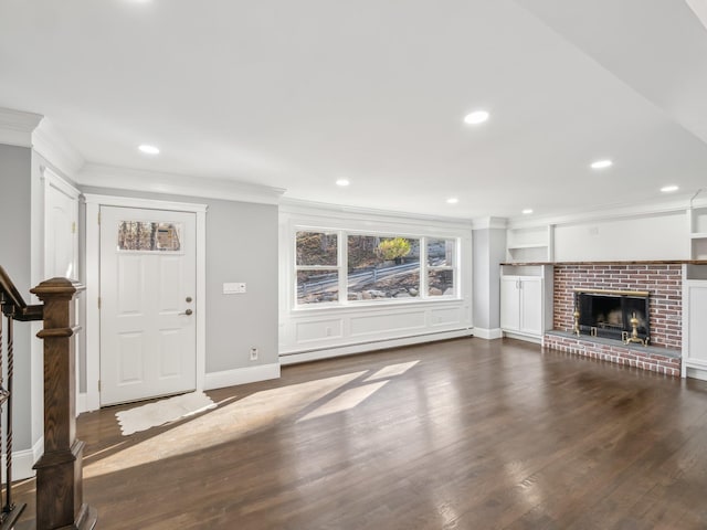 unfurnished living room with a baseboard radiator, recessed lighting, wood finished floors, stairs, and ornamental molding