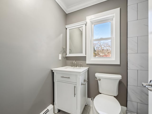 bathroom featuring ornamental molding, vanity, and toilet