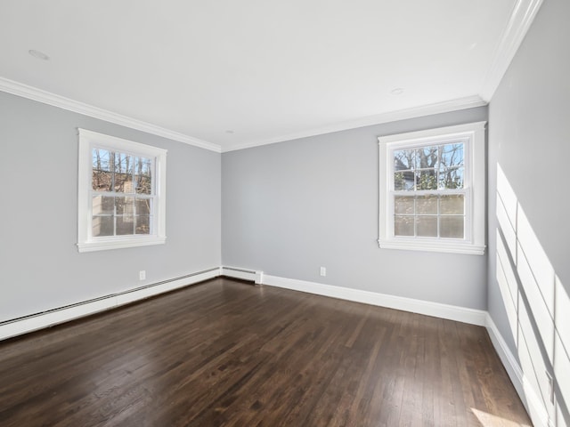 empty room featuring baseboards, ornamental molding, baseboard heating, and wood finished floors