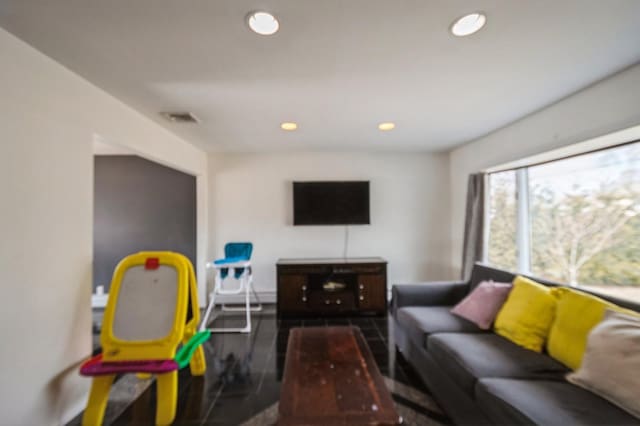 living room with visible vents and recessed lighting