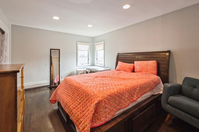 bedroom featuring baseboards, a baseboard heating unit, dark wood finished floors, and recessed lighting