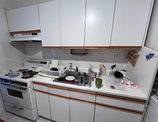 2090 Barnes Ave Unit 2H, Bronx, NY 10462 - kitchen featuring white gas range, under cabinet range hood, a sink, light countertops, and white cabinetry