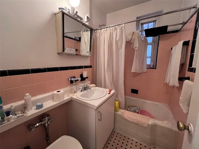 2090 Barnes Ave Unit 2H, Bronx, NY 10462 - full bathroom featuring vanity, shower / bathtub combination with curtain, toilet, and tile walls