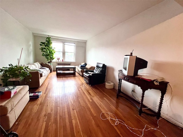 2090 Barnes Ave Unit 2H, Bronx, NY 10462 - living room featuring wood finished floors and radiator heating unit