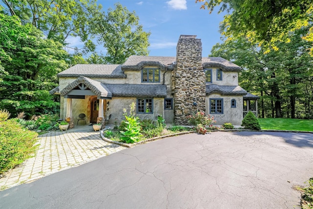 5 Shingle House Rd, Millwood, NY 10546 - view of front of property with a chimney, stucco siding, and stone siding