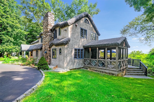 5 Shingle House Rd, Millwood, NY 10546 - rear view of property with a yard, a chimney, a sunroom, and stucco siding