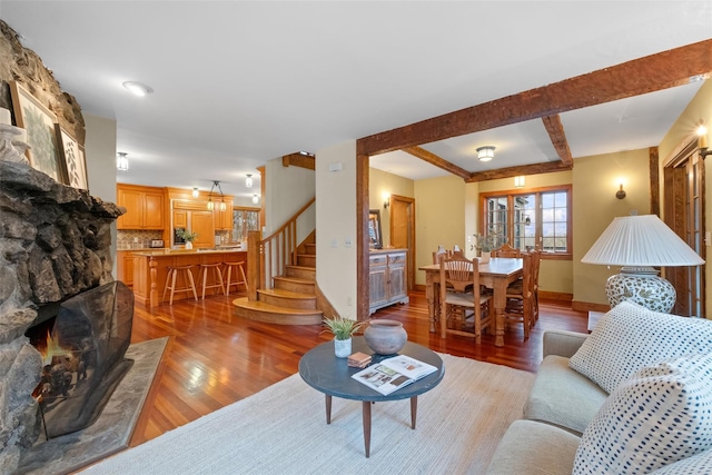 5 Shingle House Rd, Millwood, NY 10546 - living room featuring stairway, baseboards, a stone fireplace, and wood finished floors