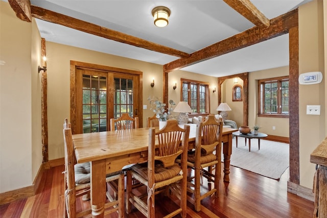 5 Shingle House Rd, Millwood, NY 10546 - dining area with baseboards, beamed ceiling, arched walkways, and wood finished floors