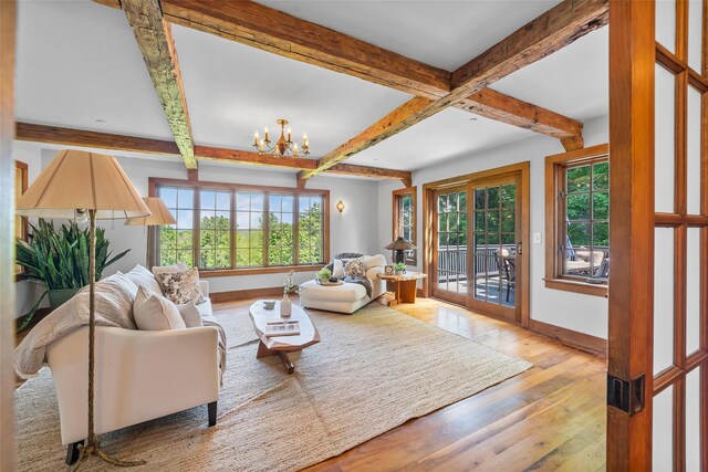 5 Shingle House Rd, Millwood, NY 10546 - living room with wood-type flooring, plenty of natural light, baseboards, a chandelier, and beamed ceiling