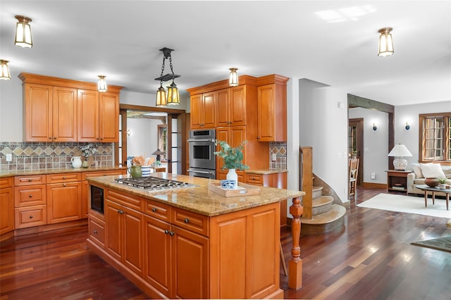 5 Shingle House Rd, Millwood, NY 10546 - kitchen featuring appliances with stainless steel finishes, dark wood-style floors, tasteful backsplash, a center island, and light stone countertops
