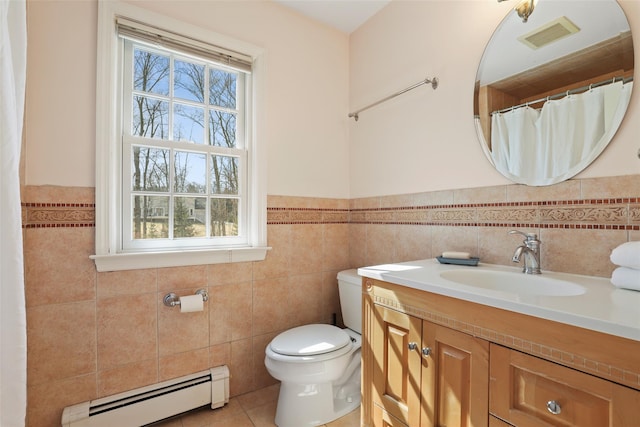 full bath with a wealth of natural light, a baseboard heating unit, toilet, and visible vents