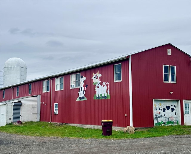 view of side of property with a garage