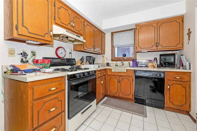 kitchen featuring light countertops, dishwasher, under cabinet range hood, and gas range oven