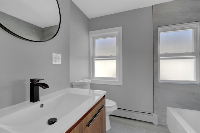 full bathroom featuring a bathtub, a baseboard radiator, vanity, and toilet