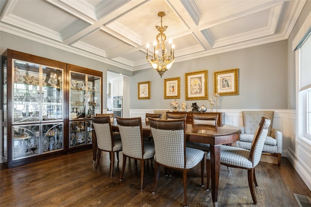 dining space with visible vents, dark wood finished floors, coffered ceiling, beamed ceiling, and an inviting chandelier